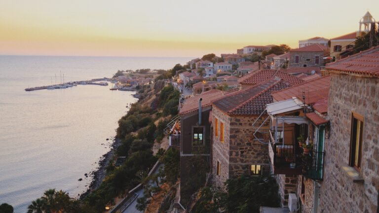 Restaurants with terraces overlooking the harbor in Molyvos, Lesvos, during sunset