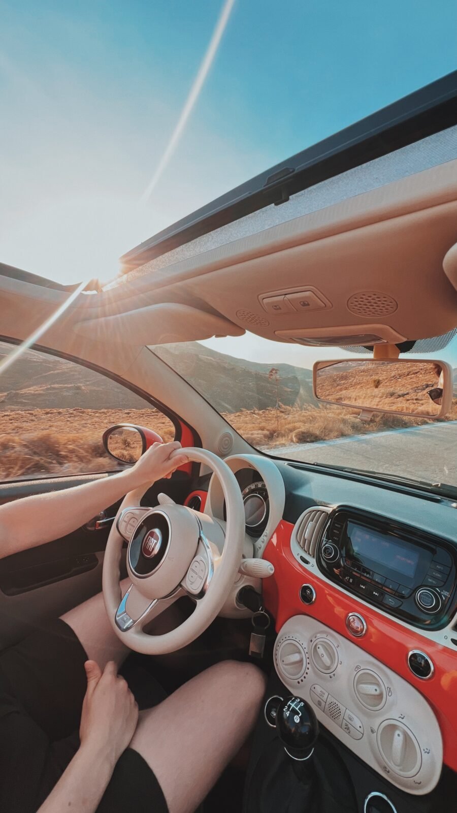 Driving a red fiat on Lesvos in the sunset