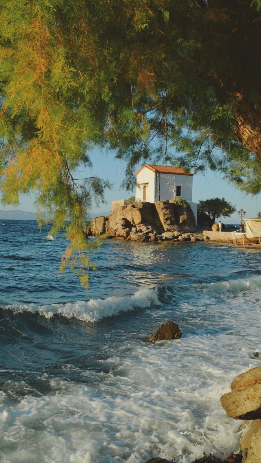 Small church by the water in the fishing village of Skala Sikamineas, Lesvos, Greece.