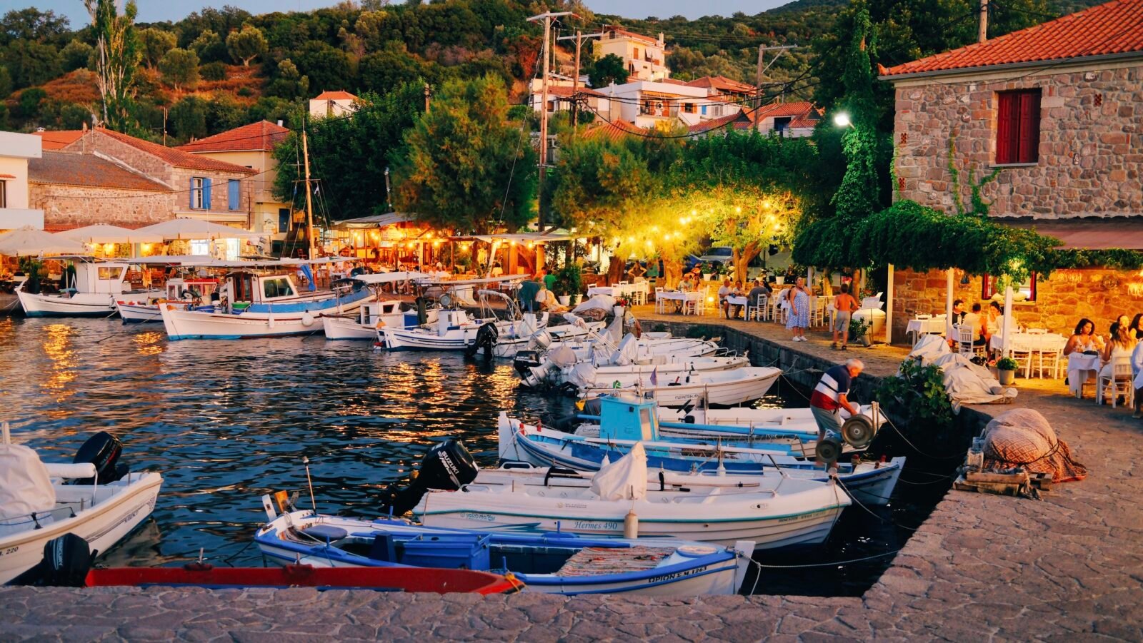 Fishing boats docked at the harbor in Skala Sikamineas, Lesvos, Greece.