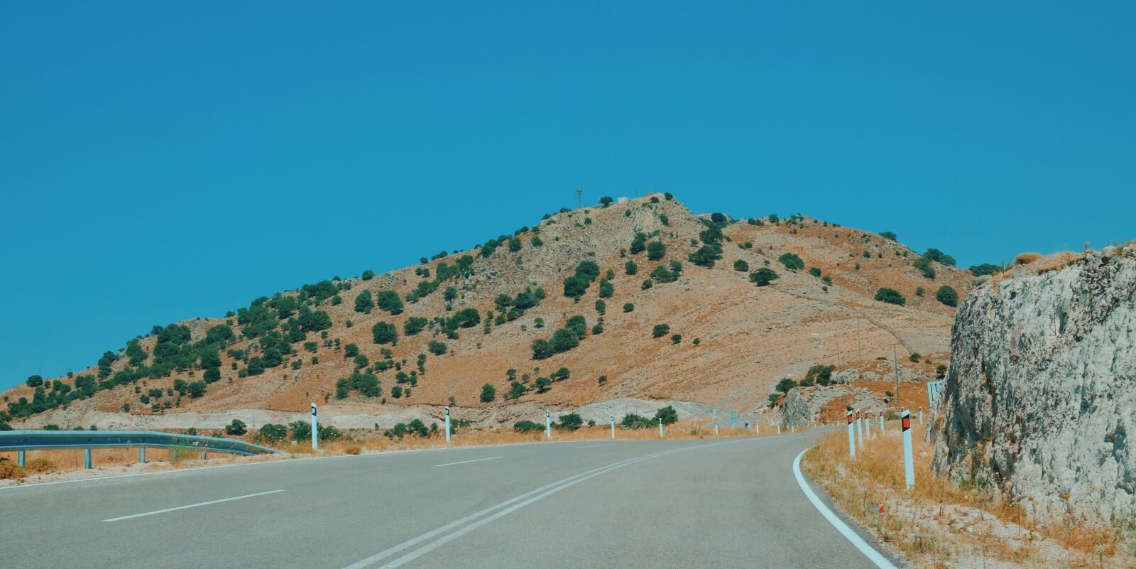A well-maintained main road through the Greek countryside