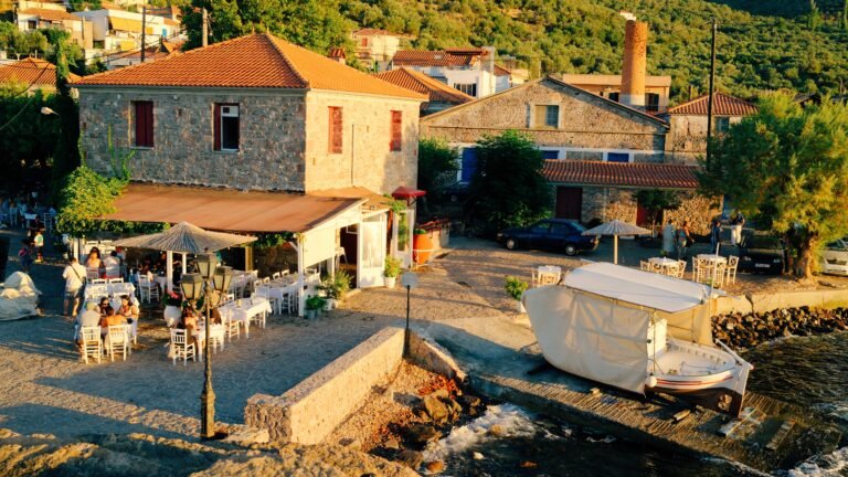 Skala Sikamineas harbour and waterfront restaurants at golden hour, Lesvos, Greece.