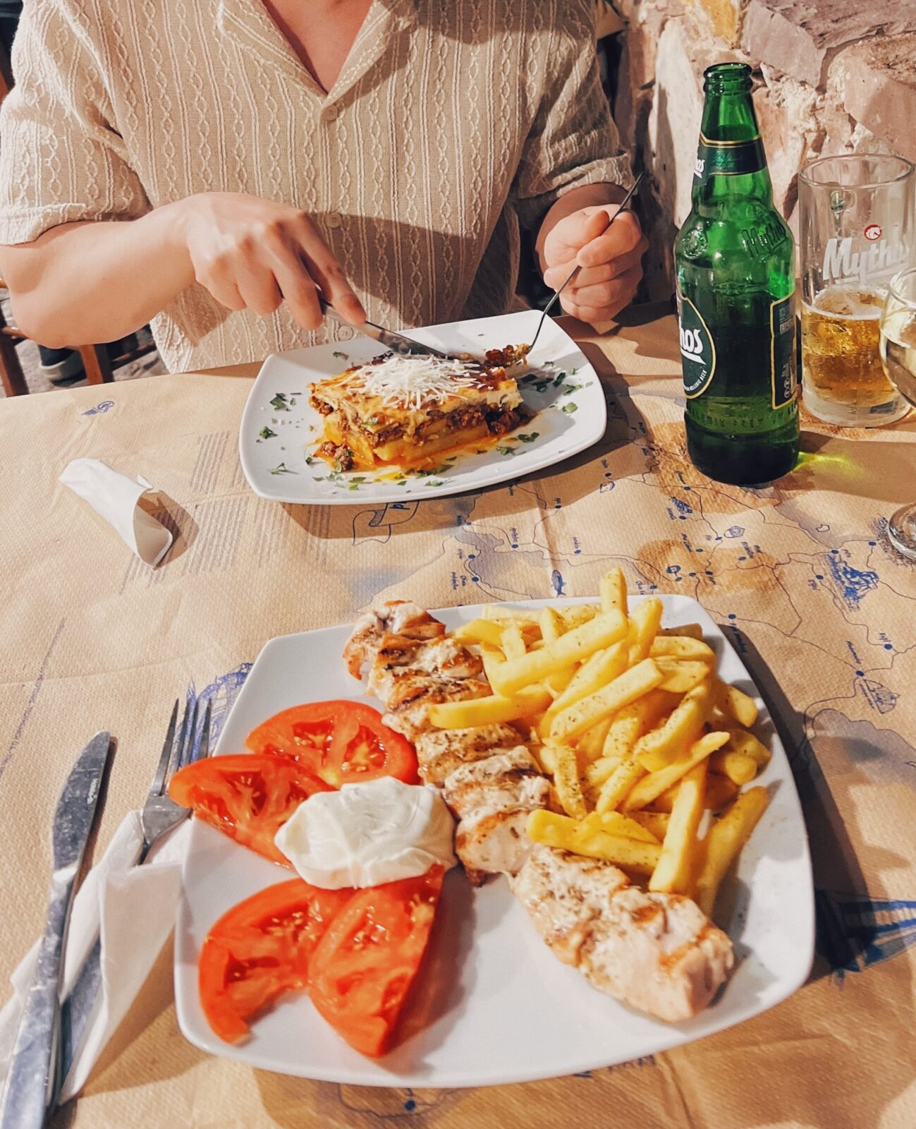 Greek moussaka and grilled skewers with Greek beer at Martin's Restaurant in Molyvos
